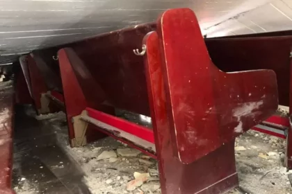 Photos from inside the church show the roof on top of the pews Photo: Reuters